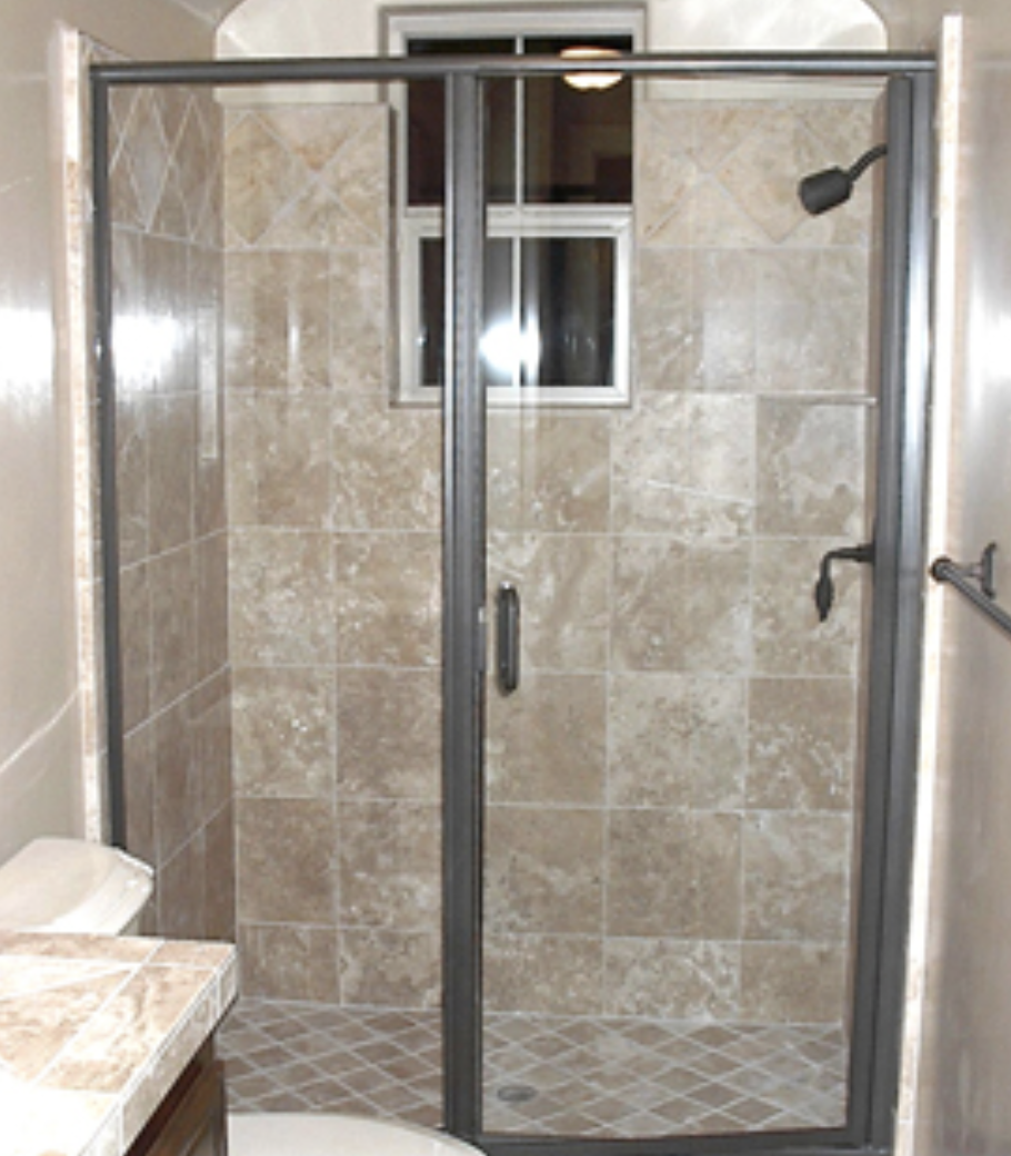 Semi-Frameless Hinged Shower Door (Photo courtesy of americanshowerandtubdoor.com) The least expensive option for a hinged shower, semi-frameless shower doors have a frame at the sides, bottom and top of the enclosure to stabilize the glass. The glass door itself has a full length integrated metal hinge on the hinge side but no metal border otherwise. This door has clear glass with brushed nickel finish. 