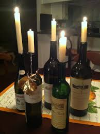 Arrange a wine bottle vignette, adding green and white candles! 