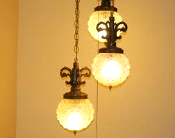 The chain and globe swag. Actually I still love these lights and feel they look fantastic instead of bedside lamps. 