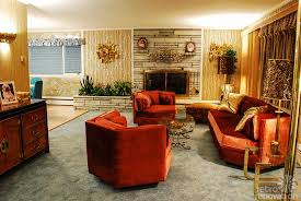 The Living room - American Hustle. Here you can see the golden and burnt orange tones of this design era. HOT! Also it continues to inspire design today - check out the metals in the room!