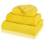 Stack your towels, and tie up with a ribbon on display. 