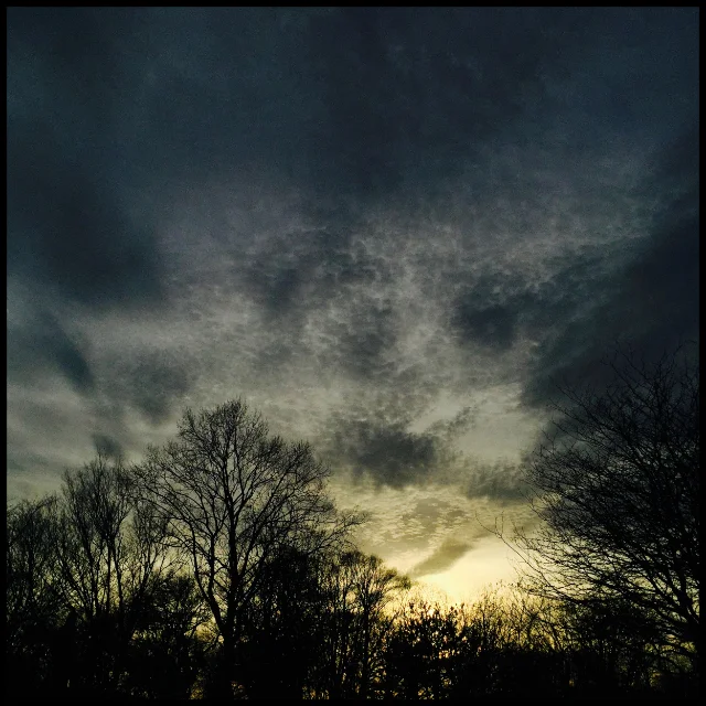 Cloud mosaic above setting sun