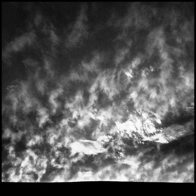 Clouds at sunset, barn roof line