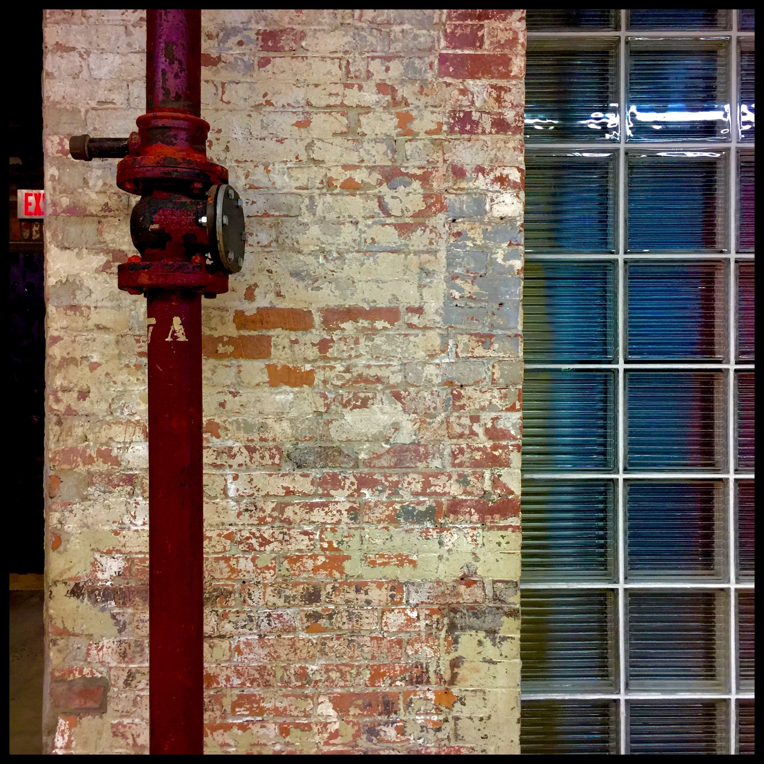 Prismatic corroded metal, layered paint, and glass reflections