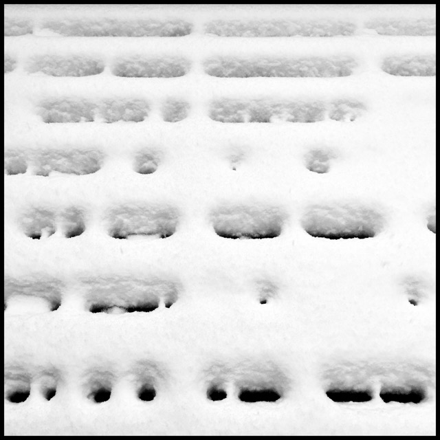 Morse code from the spaces in snow-covered decking