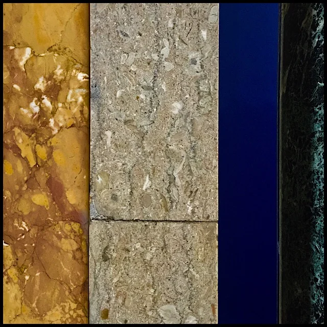 Wall detail in gold, gray, blue, and black