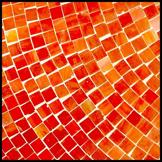 Mosaic detail with fiery tesserae