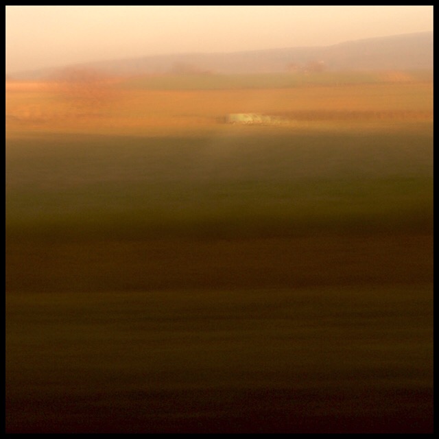Rural landscape 6 at sunset from train gliding at 200 mph