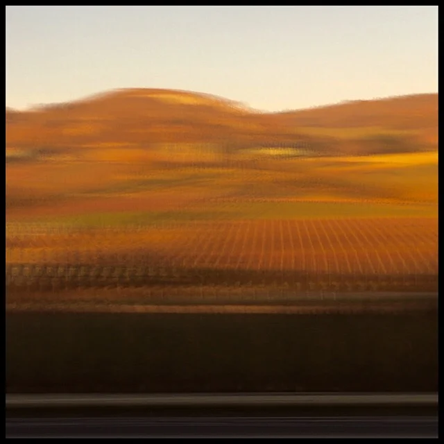 Rural landscape 7 at sunset from train gliding at 200 mph