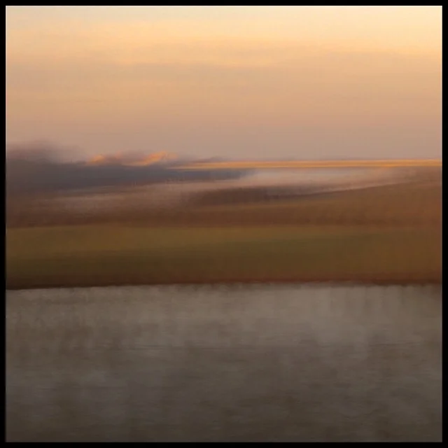 Rural landscape 12 at sunset from train gliding at 200 mph