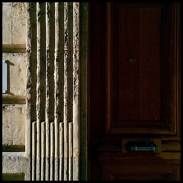 Exterior wall detail with fluted pilaster, door