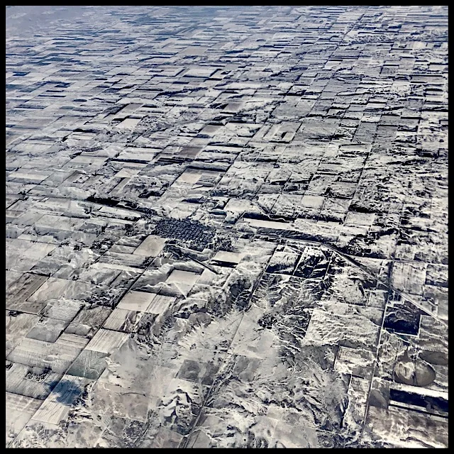 Snow-dusted plains from 34,000 ft.
