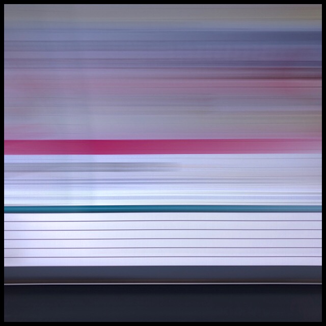 Métro station platform from moving train, slow shutter