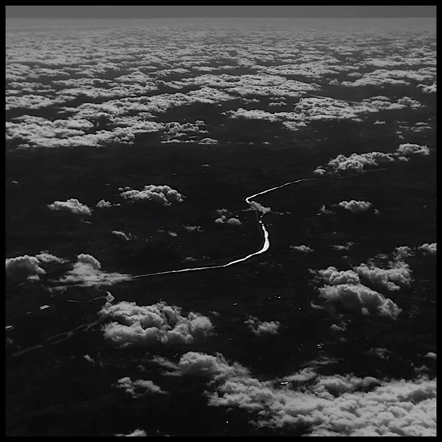 River and ponds mirroring bright sun