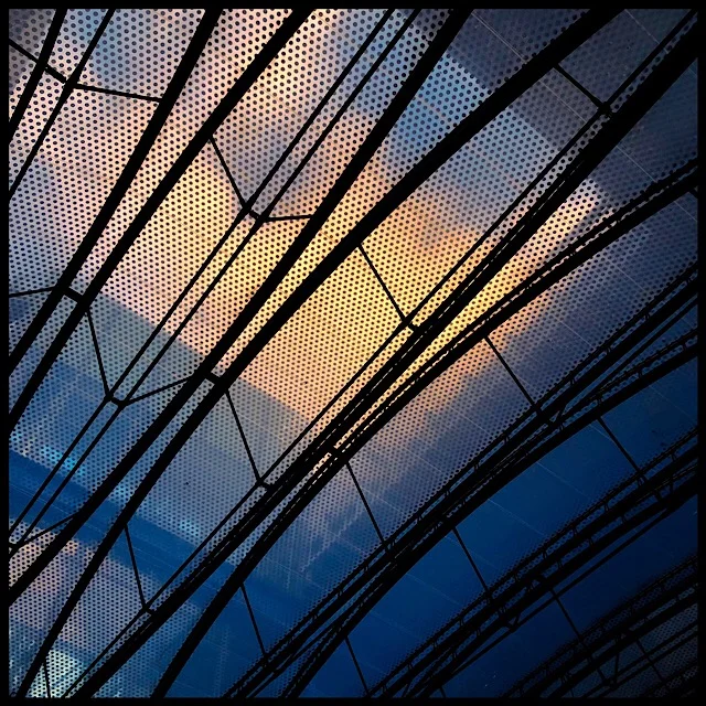 Translucent roof, evening clouds
