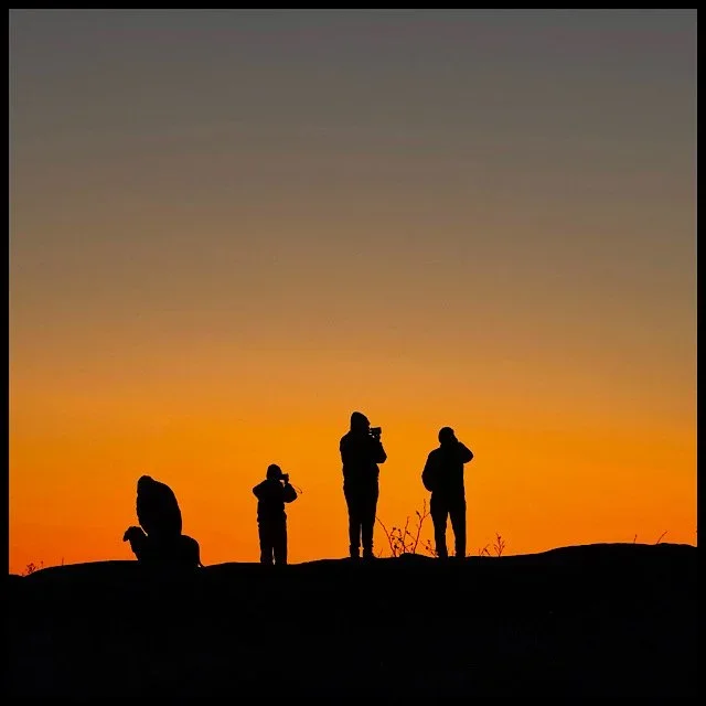 Four humans, one dog, summit sunrise