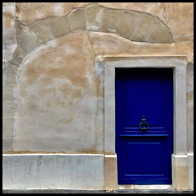 A blue door where an arch used to be
