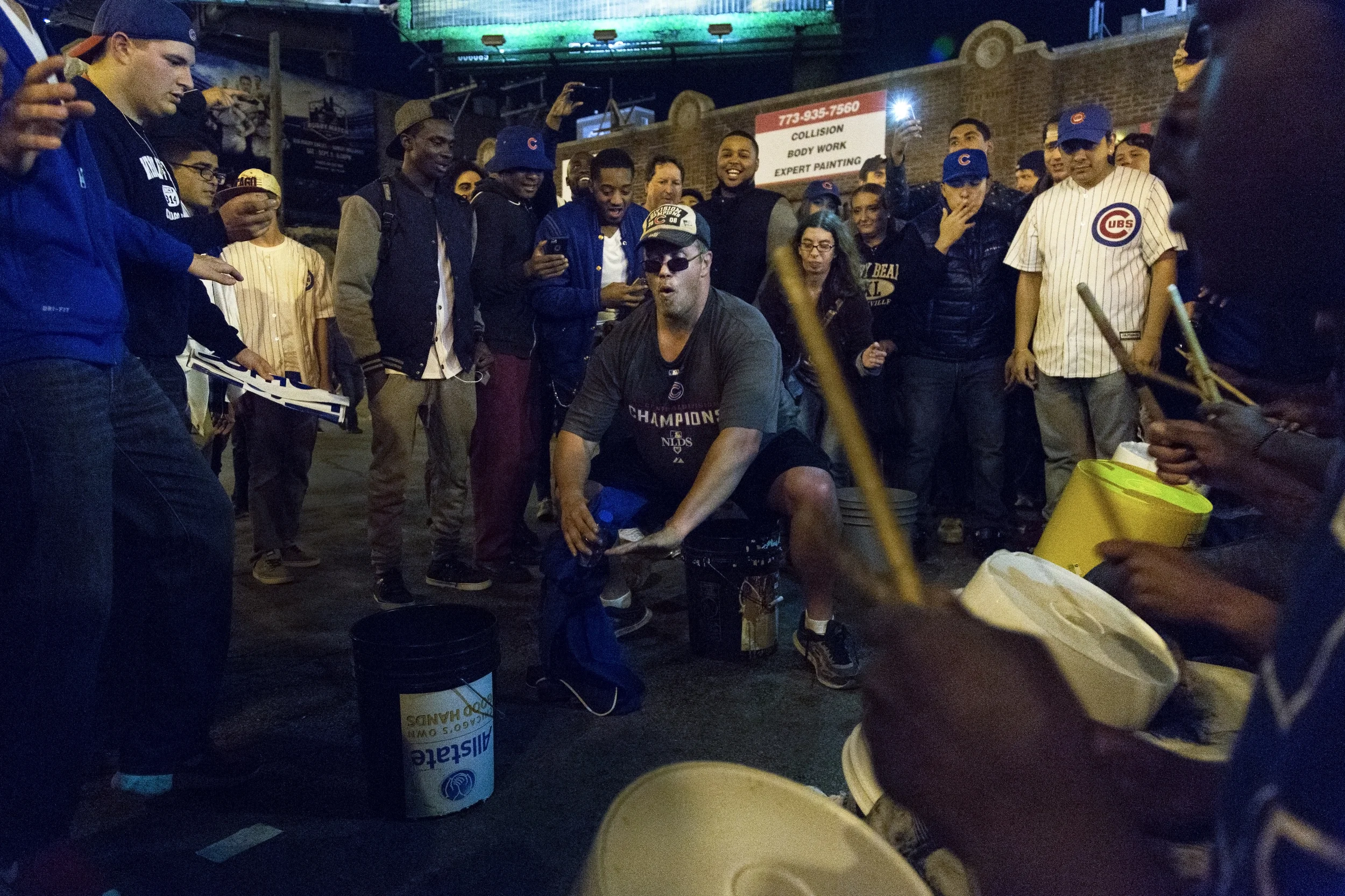 Fans celebrate with dancing and cheering outside of Wrigley Field after the Chicago Cubs beat the St. Louis Cardinals in Game Four to win the National League Divisional Series on October 13, 2015 in Chicago, Ill.