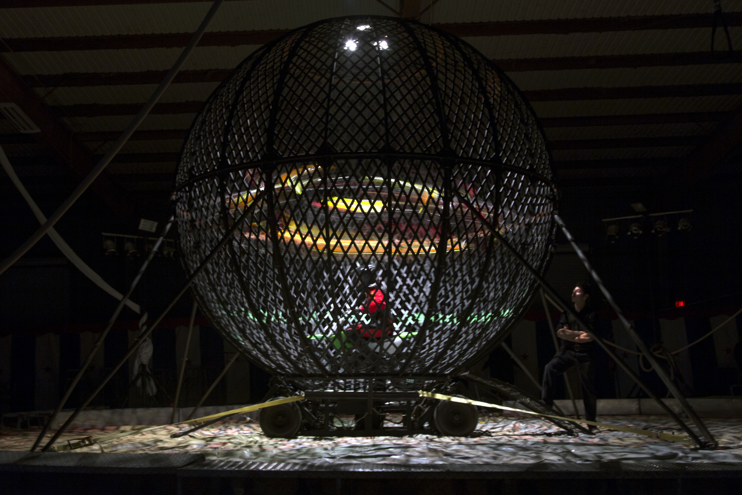 Four stunt riders loop inside the Globe of Death as part of the Motorcycle Madness act during the Al Amin Shrine Circus at the Victoria Community Center Arena on Monday, January 4, 2016, in Victoria, Texas.