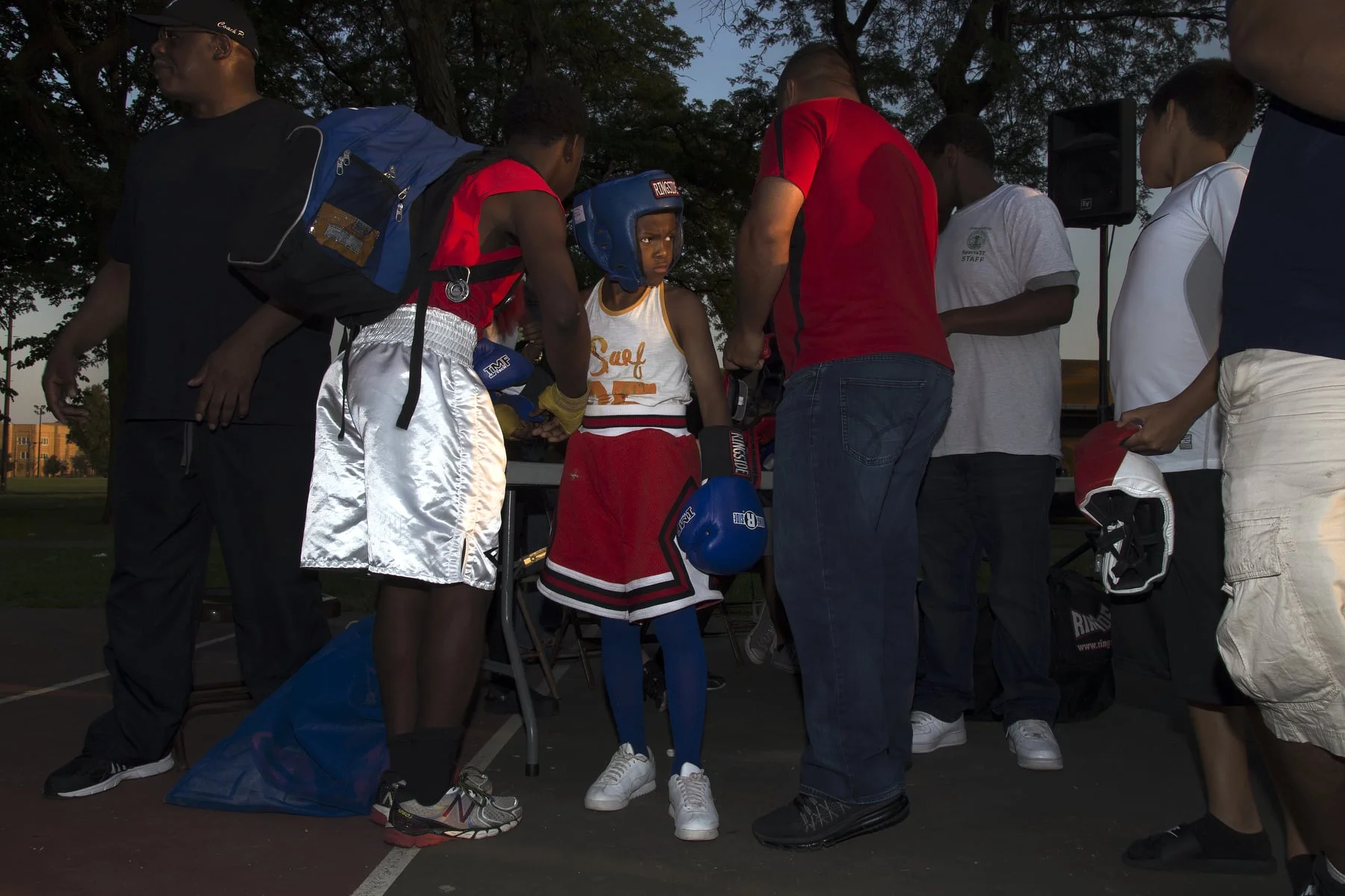 Dorian Turner, 10, of the 70-pound weight class, prepares for his boxing match during a "night fight" on Thursday, July 23, 2015, at Chicago's Taylor Park. Turner won the match.
