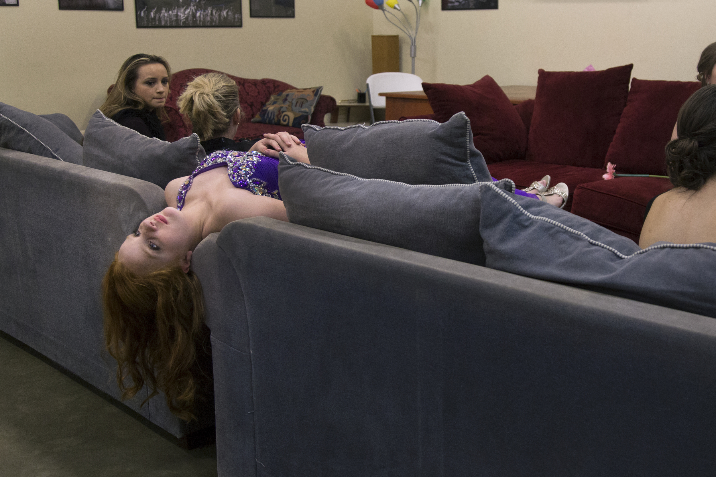 Carlie Parsons, a contestant for Junior Queen Victoria, relaxes backstage during the intermission of the Queen Victoria Pageant on Saturday, January 31, 2016, in Victoria, Texas.
