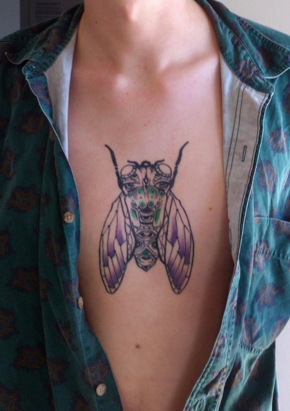 cicada-tattoo-ink-insect-chest-sam-shennan-ud3-sydney-tattoo-designer-in-skin-pretty-colourful-line-1.jpg