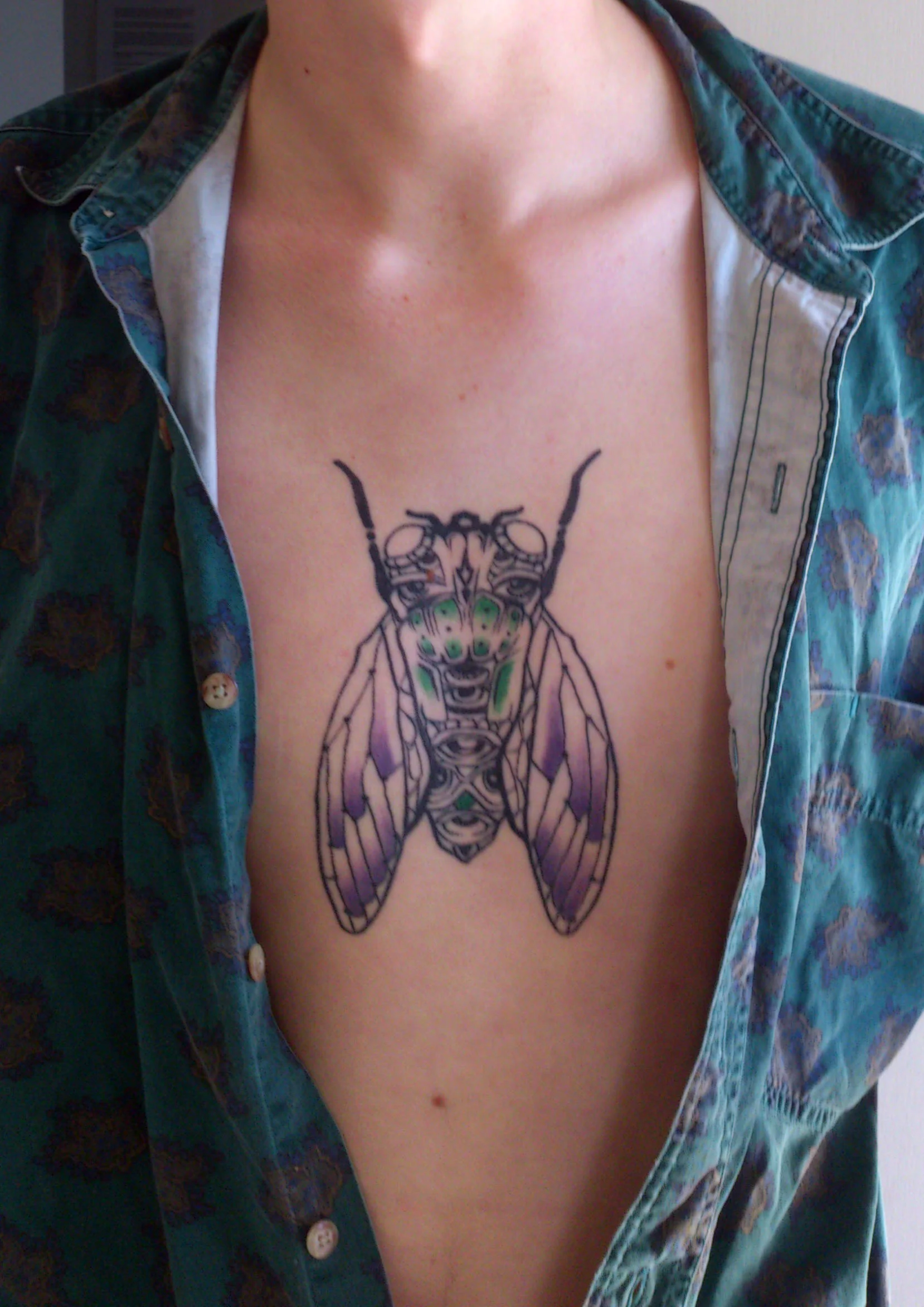 cicada-tattoo-ink-insect-chest-sam-shennan-ud3-sydney-tattoo-designer-in-skin-pretty-colourful-line.jpg
