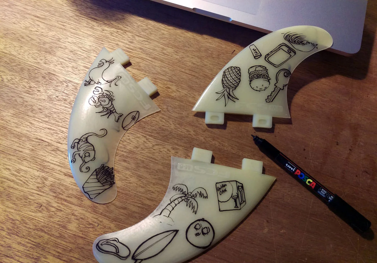 Process of hand painting some custom surfboard fins
