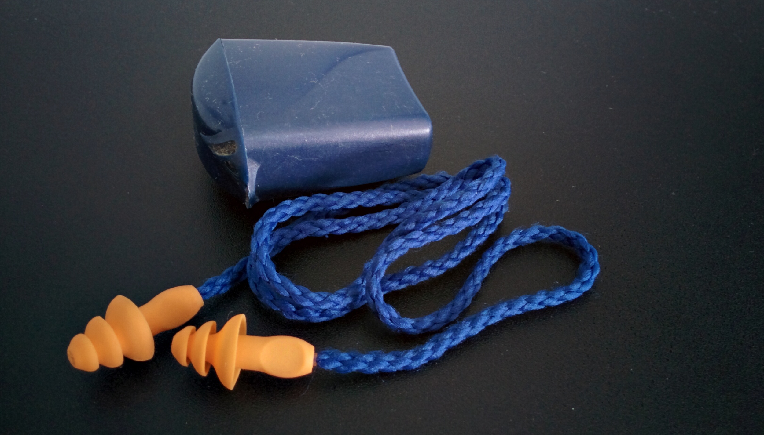 Flanged type reusable earplug (3M) with carrying case, not really suitable for music listening though