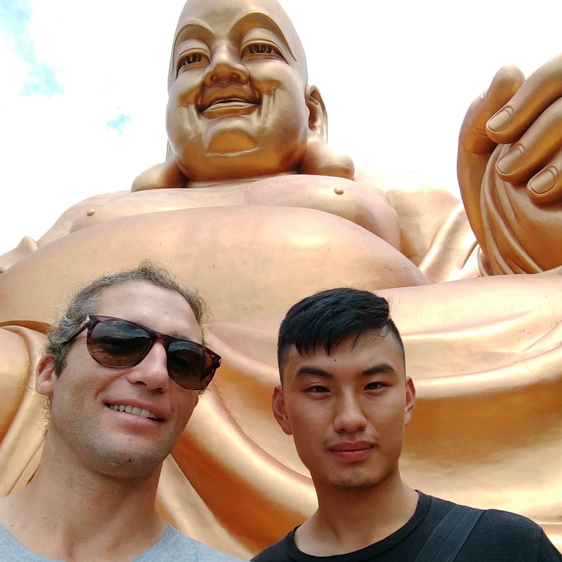 Hugging the feet of the Buddha
