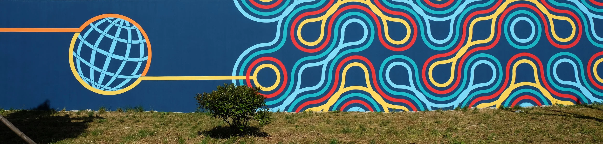 International Spirit, represented by a globe flowing into another endless knot variation