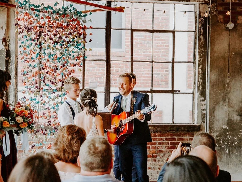 “I'll miss you, kiss you, give you my coat when you are cold. | Need you, feed you, I'll even let you hold the remote control…” Yes the groom sang THAT song and it was amazing! | Photo by Tori Alizabeth