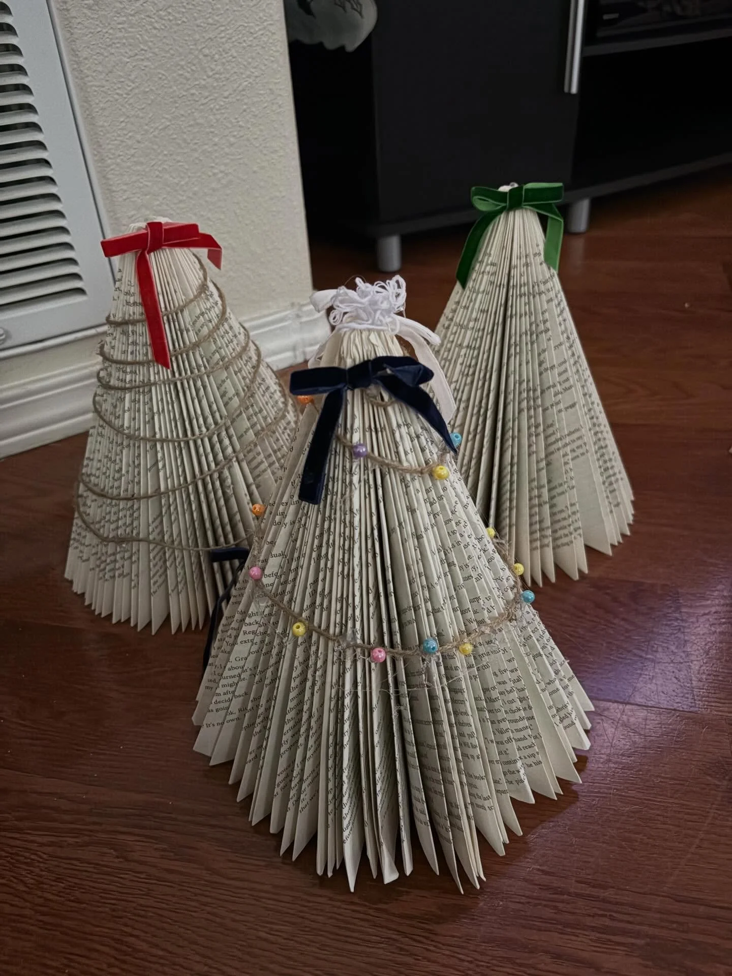 Merry Christmas from my family to yours! 
My book trees ended up looking like sad Victorian ghosts but I&rsquo;m into it. 
Also 50% (up to 89%) of my brain is anticipating the cottage episode of Heated Rivalry while the rest is focused on how long I 