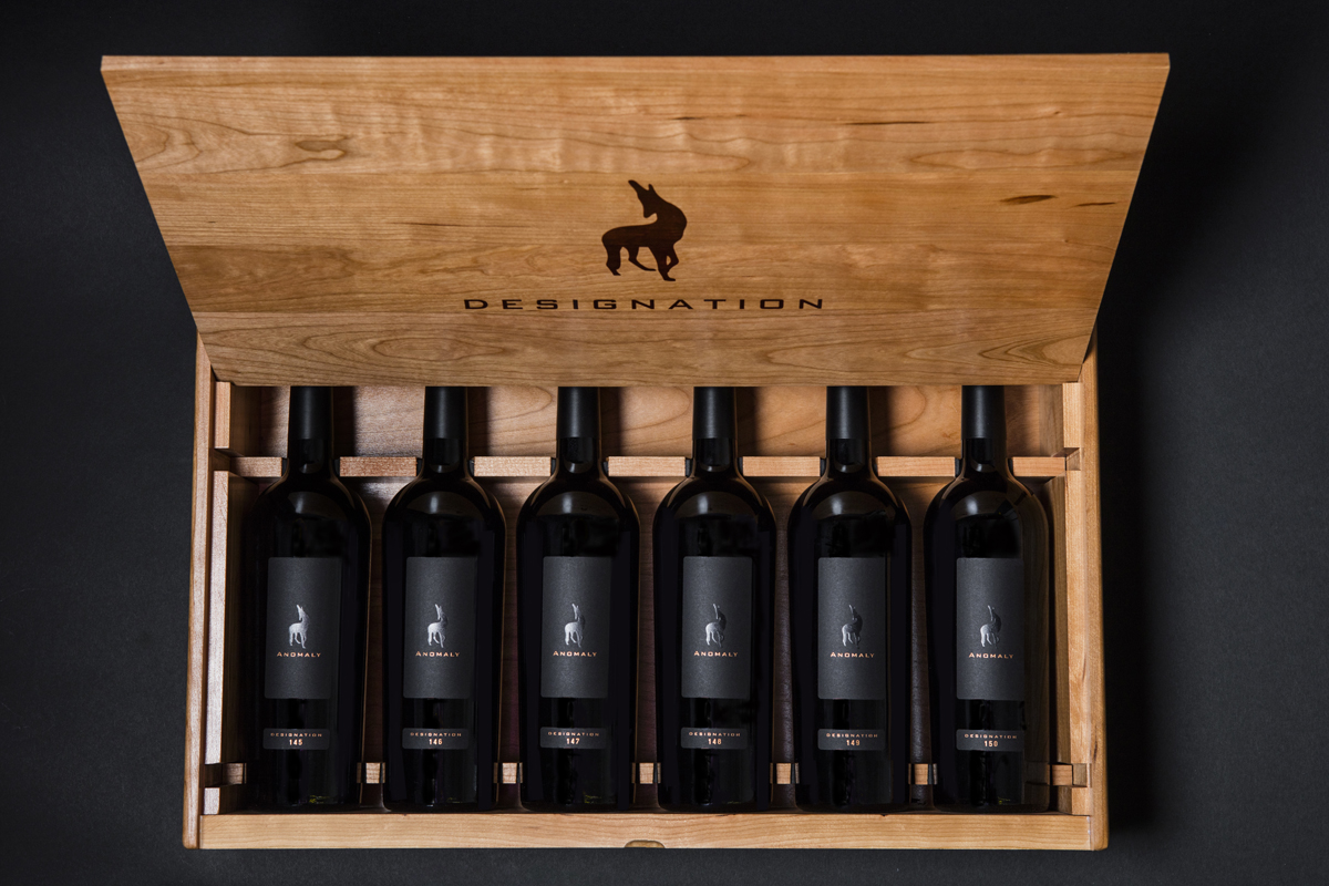 Six bottles of Designation in wood box