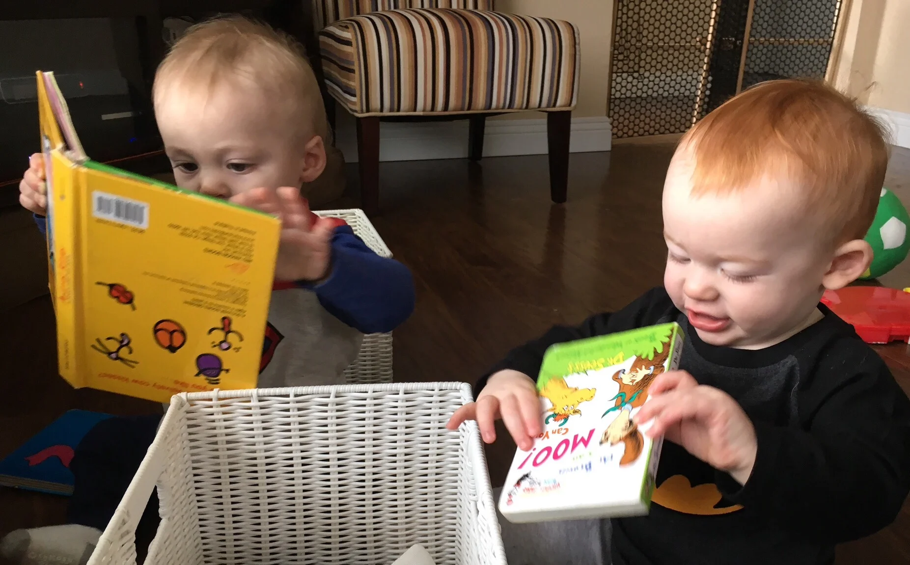 Julian and Joshua love books even if they're upside down.