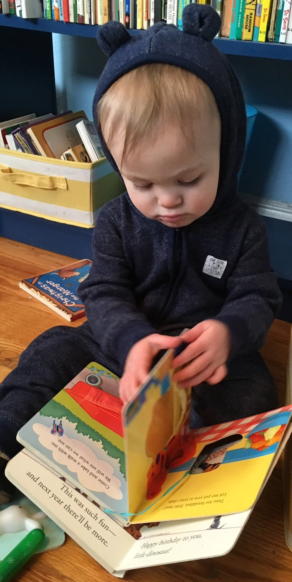 Julian with some books. This librarian mama is happy that both boys like books!