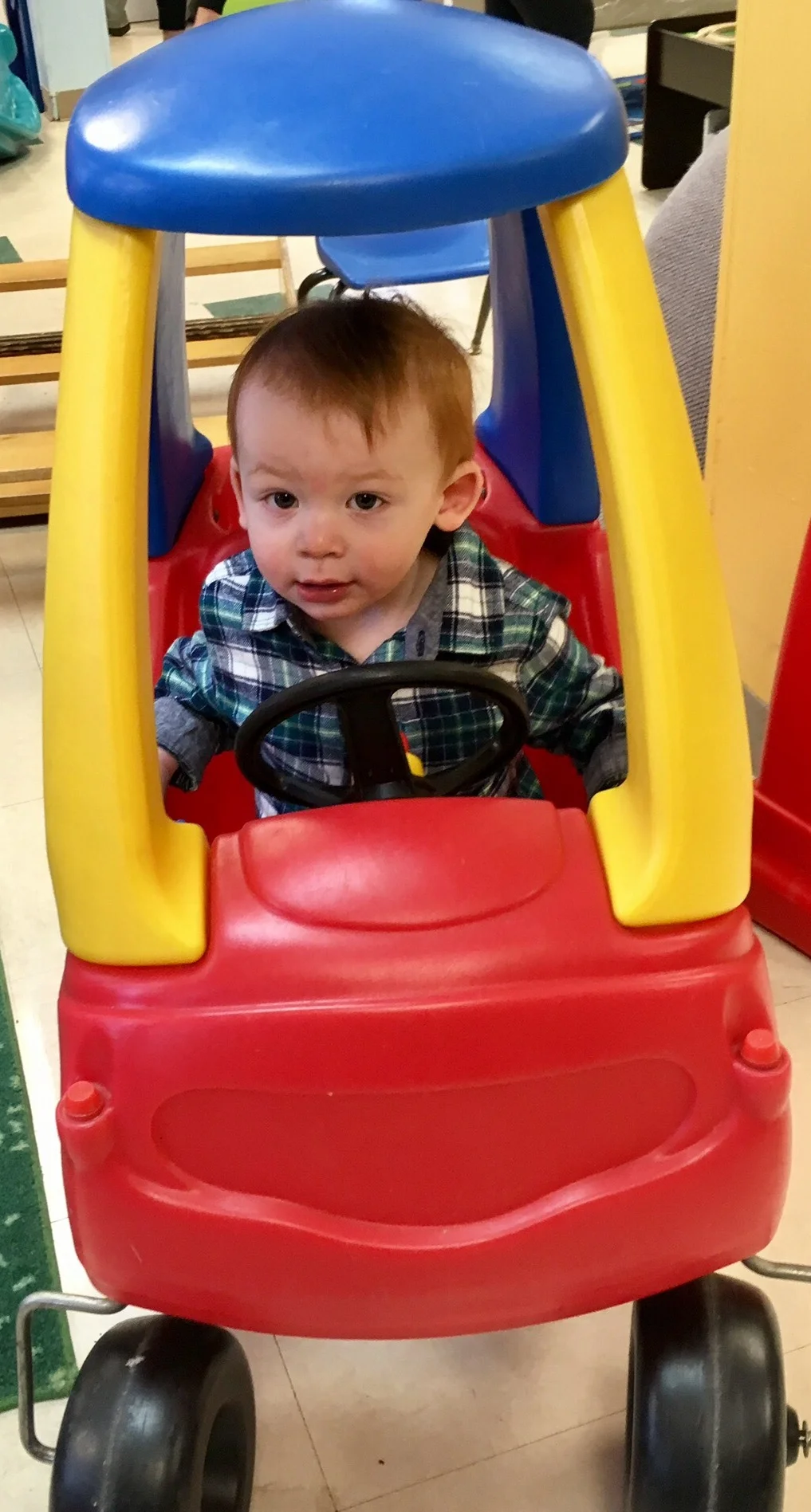 Joshua learning to drive at the Seesaw Center.