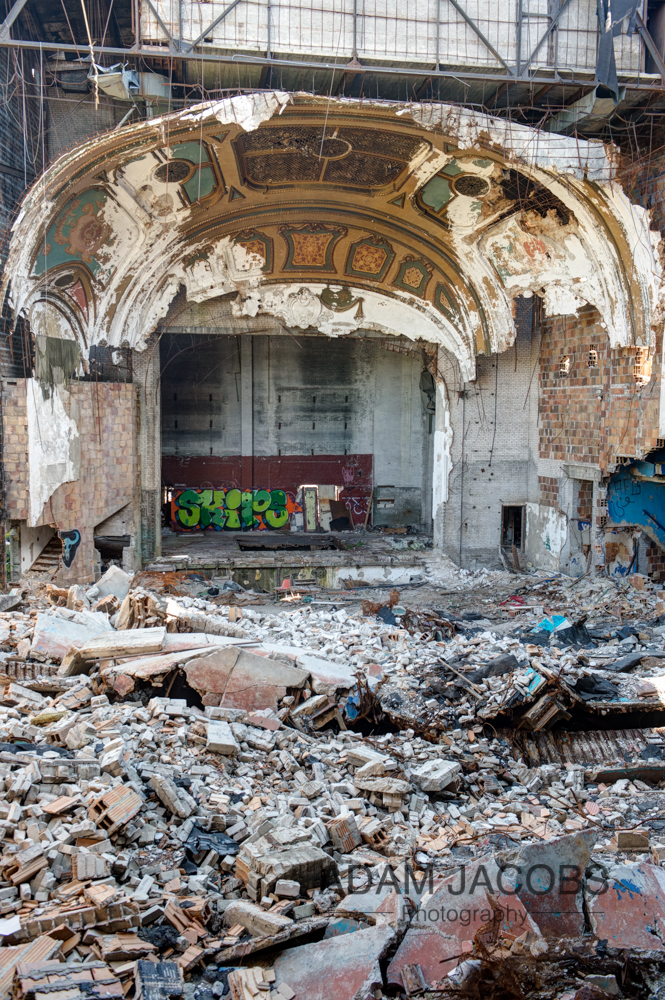 The remains of the stage with the rubble of the recently fallen in roof.