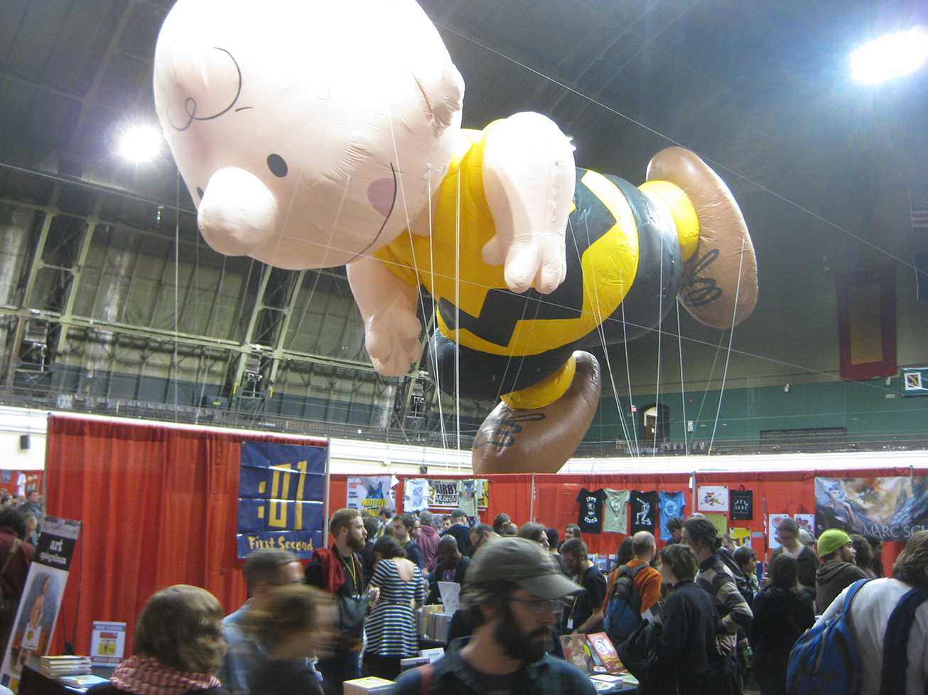 Charlie Brown, licking his lips about to feast upon all the MoCCA-festers.