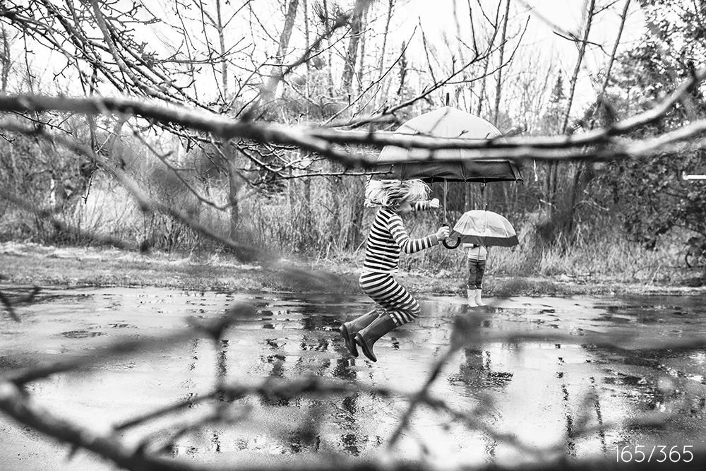 After dinner, after PJs, I was looking out at the big giant puddles thinking that I need some good puddle stomping images. I always love it when you guys get some fresh air not long before bed, and now that Spring is here, we can do that any day - rain or shine. 