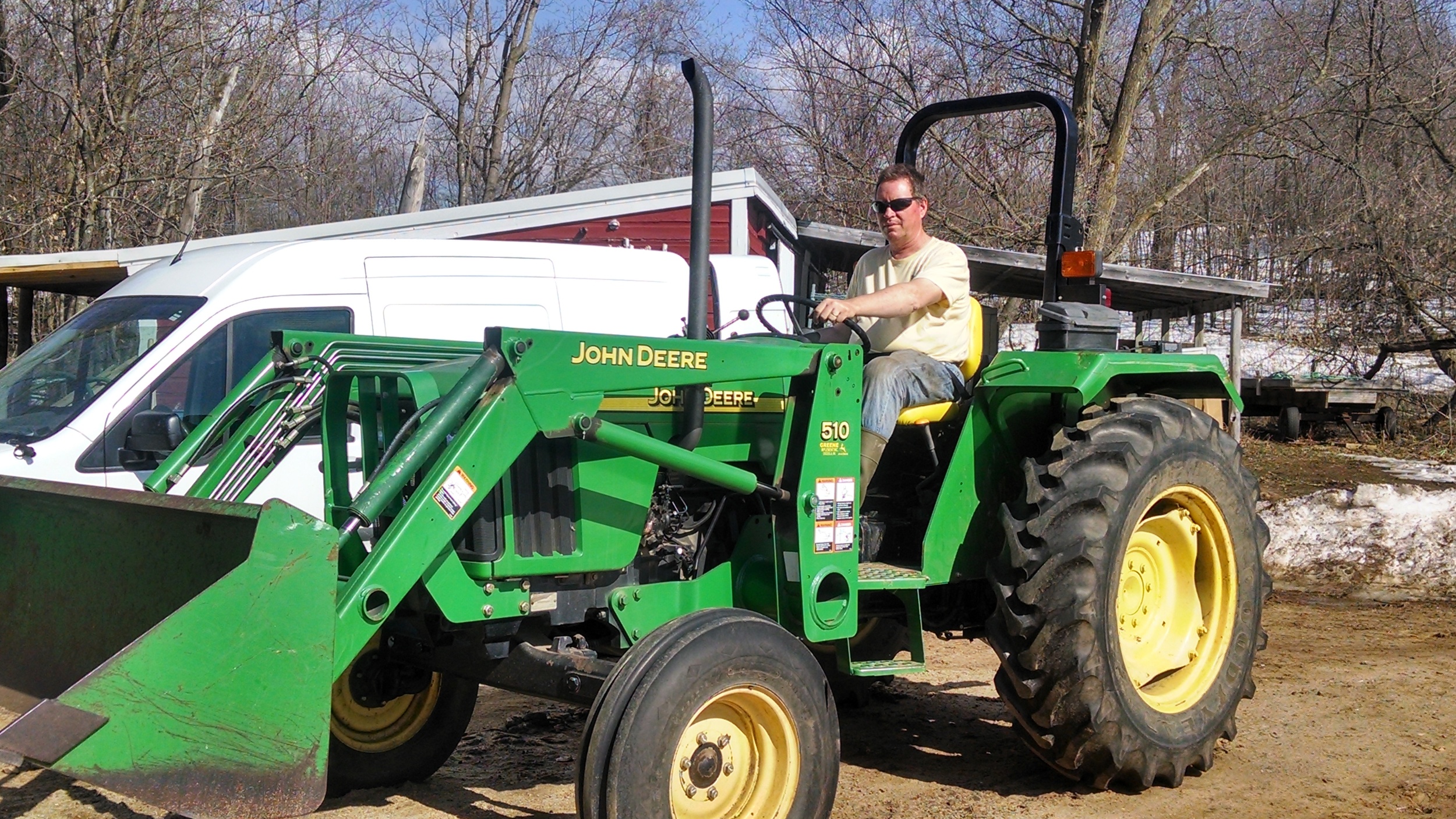 This farmer loves the sweet hum of his tractor!