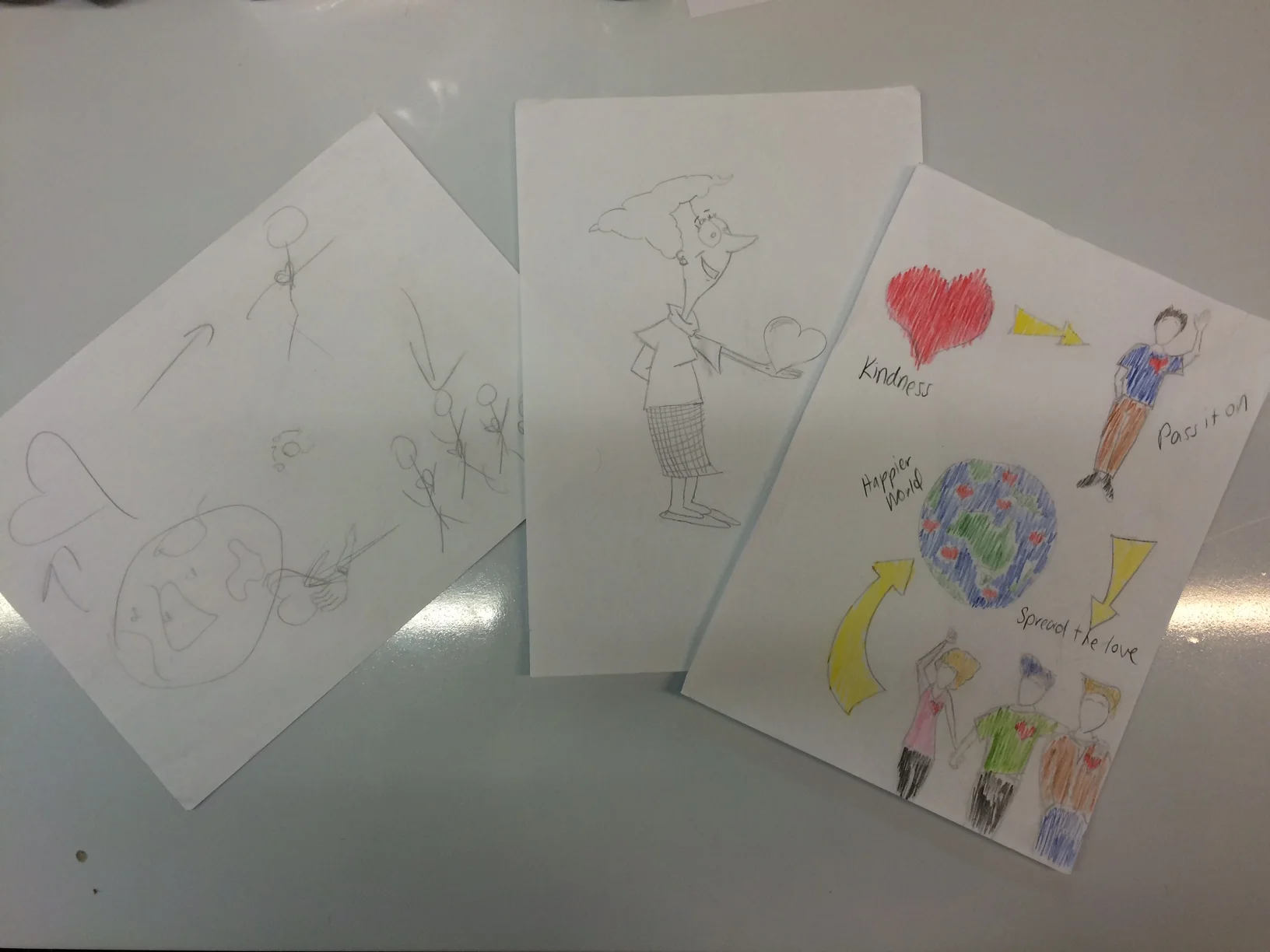 NOTE FROM AMY: I cheated and asked my fiance to draw something based on my sketch (on the left) and explained the random act of kindness idea. He didn't really understand the brief, so he draw the old lady in the middle, which I had to include because it's so hilarious. Then he did what I said and drew an infographic that I coloured in (on the right).
