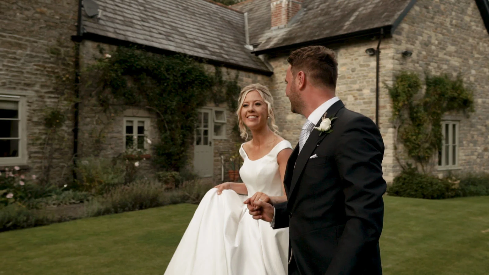 Bride and Groom walk hand in hand