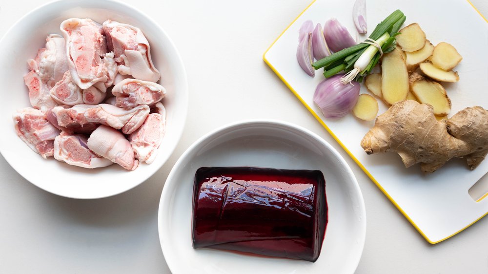 Pork blood, pork hocks/pig’s feet, scallions /green onions, and ginger