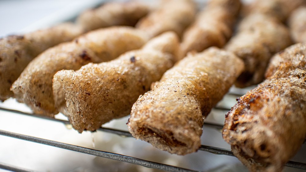 Vietnamese crispy fried spring rolls (cha gio) on wire rack