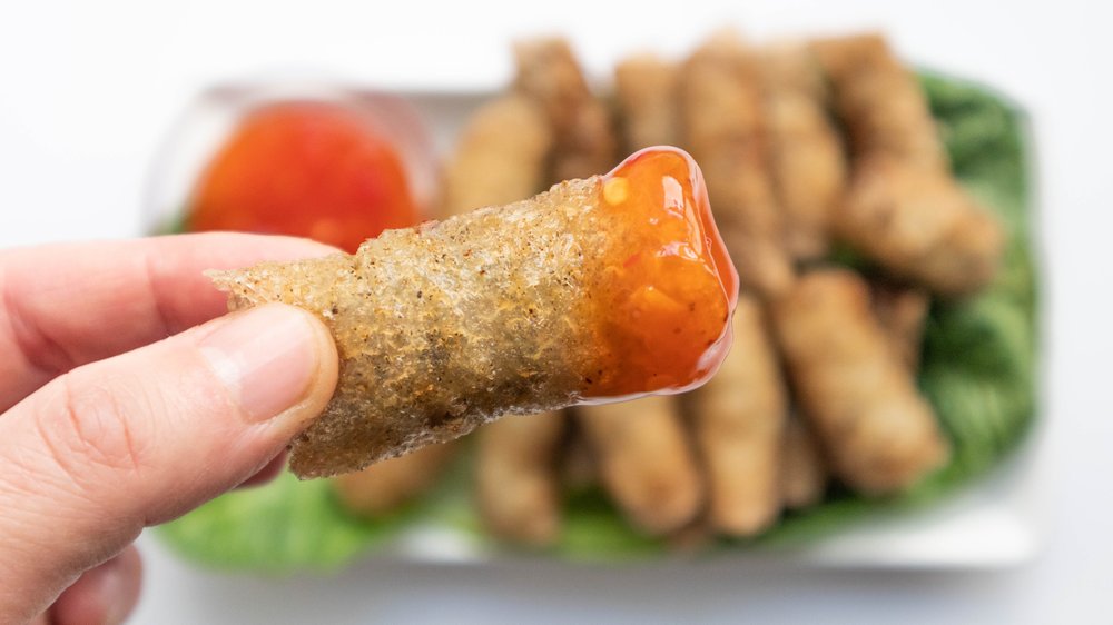 Vietnamese crispy fried spring rolls (cha gio) with sweet chili sauce