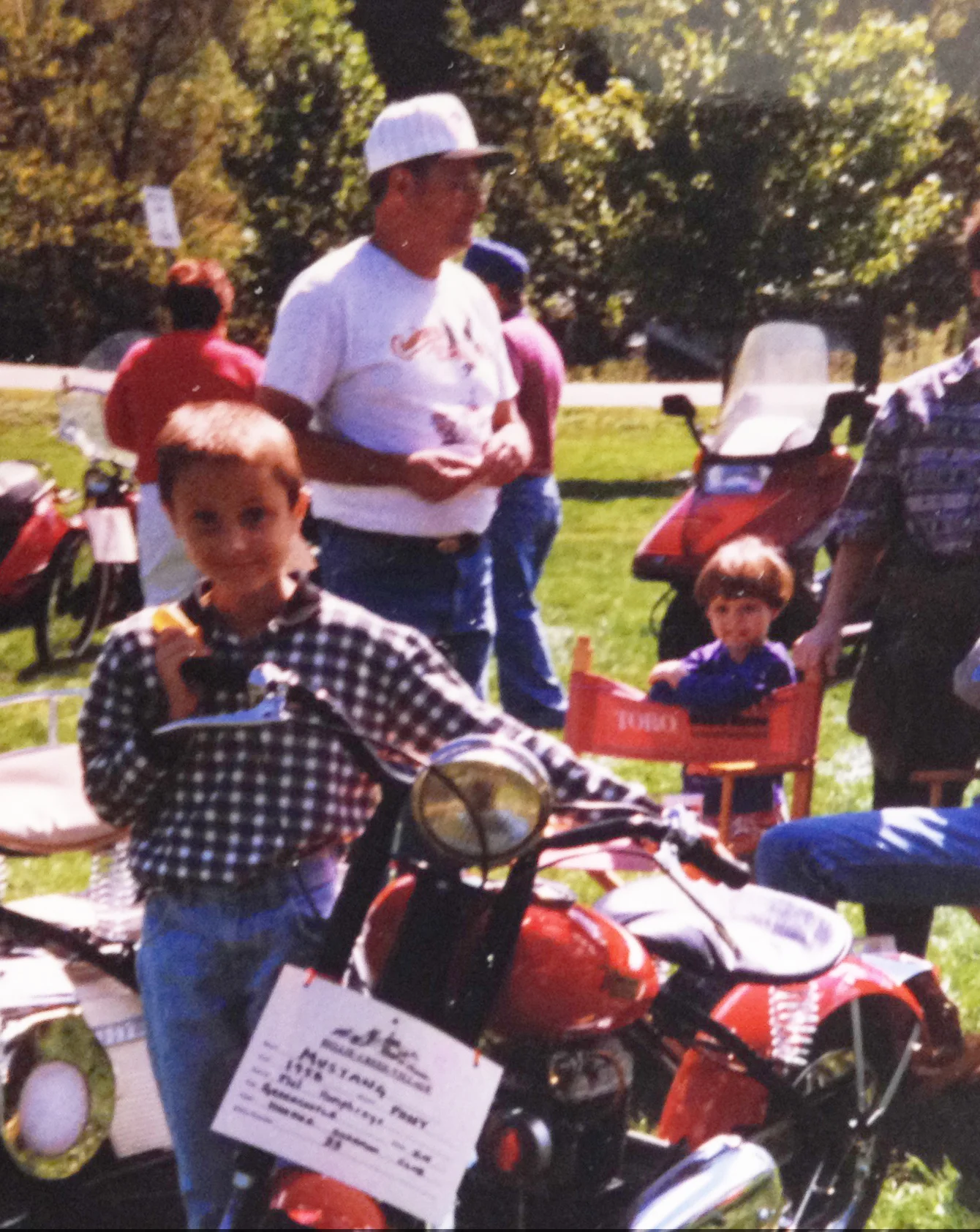 Me with my grandpa behind me at a scooter show.