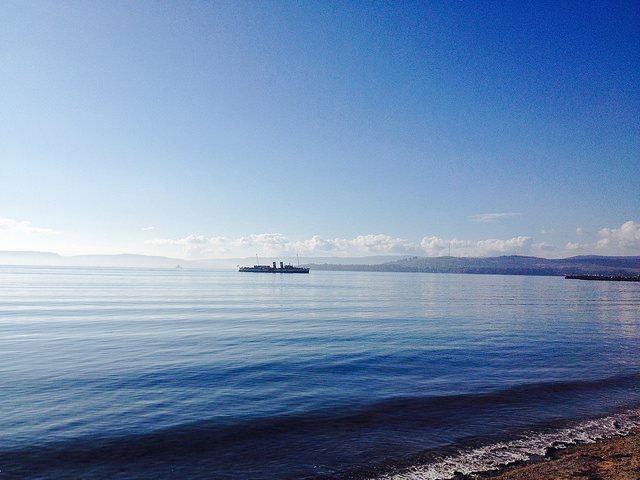 View from Helensburgh across the River Clyde with the Waverley , the world's last seagoing paddle steamer , on the water.