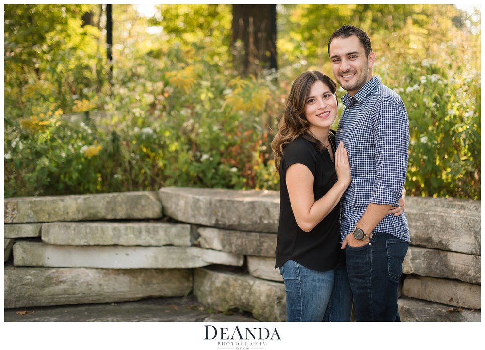 couple in front of foilage