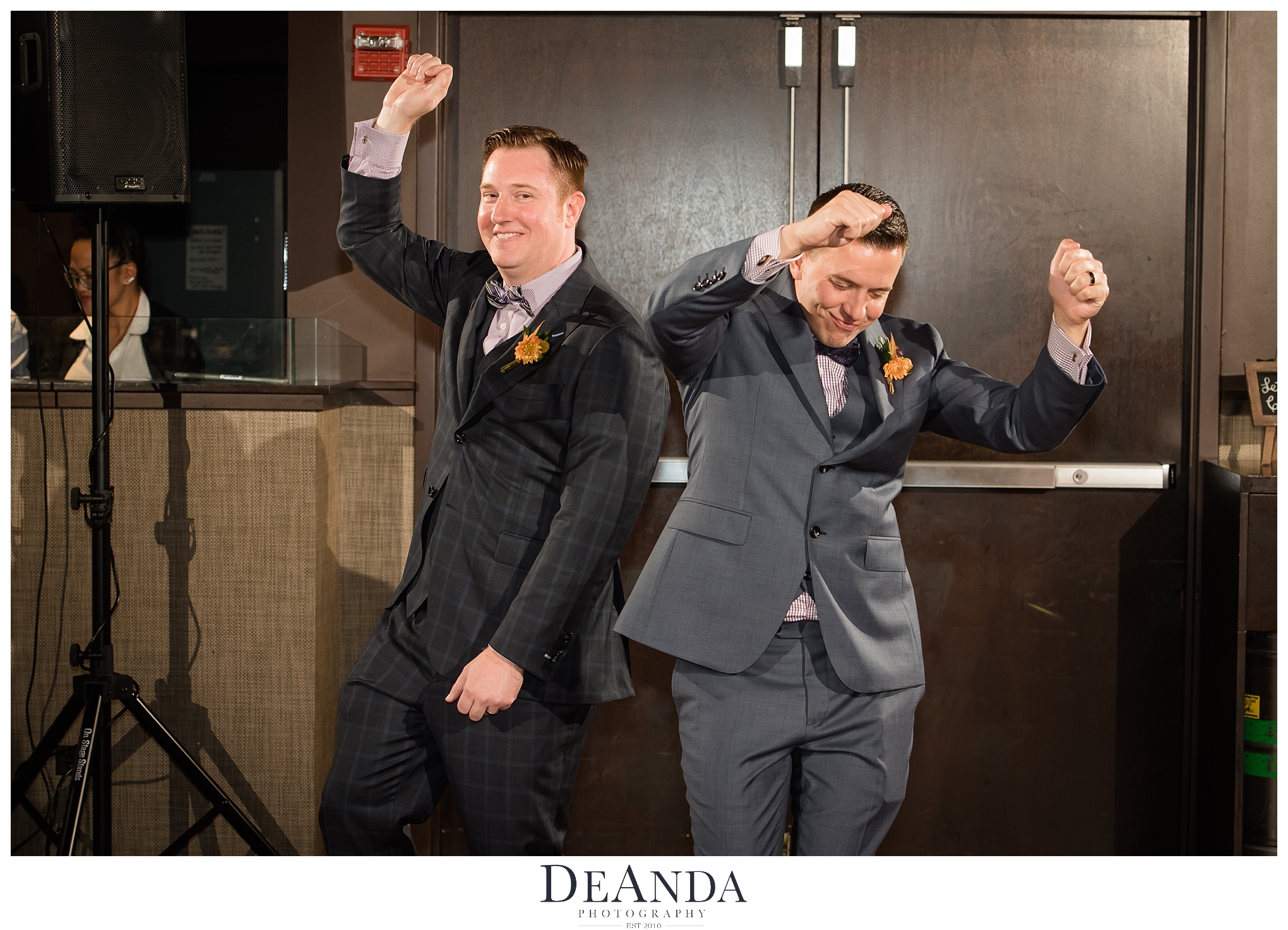 two grooms enter Howells & Hood at Tribune Tower 